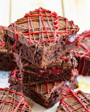 Black Forest Brownies stacked on a dish.