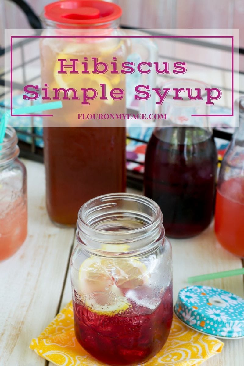 Hibiscus Simple Syrup recipe in an iced filled mason jar is used to make refreshing summer drink recipes like Hibiscus Iced Tea. 