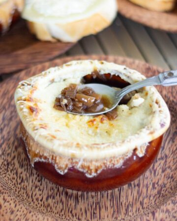 French onion soup in a brown crock.