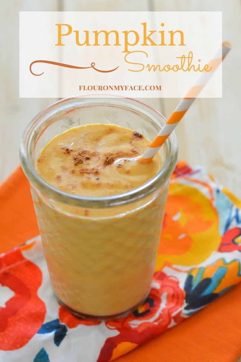 Featured image of the Pumpkin Smoothie recipe in a clear glass with a orange and white paper straw.