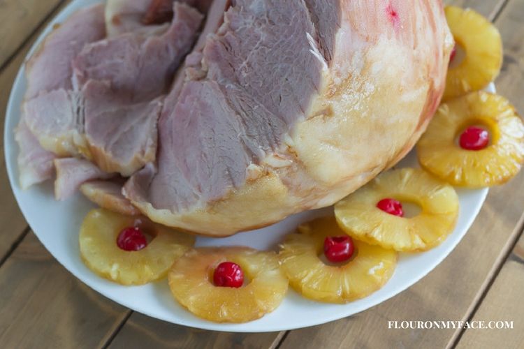 Holiday baked ham served with pineapple slices via flouronmyface.com