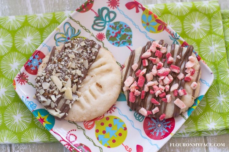Chocolate dipped shortbread cookies make a great Christmas cookie exchange recipe. Make one cookie recipe and deocrate them four different ways for 4 different holiday cookie recipes via flouronmyface.com