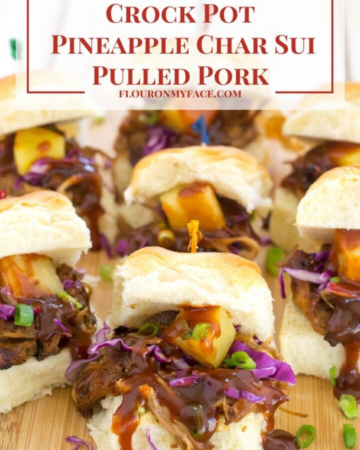 Crock Pot Pineapple Char Sui Pulled Pork sliders on a cutting board.