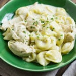 Chicken Tortellini Alfredo in a green serving bowl