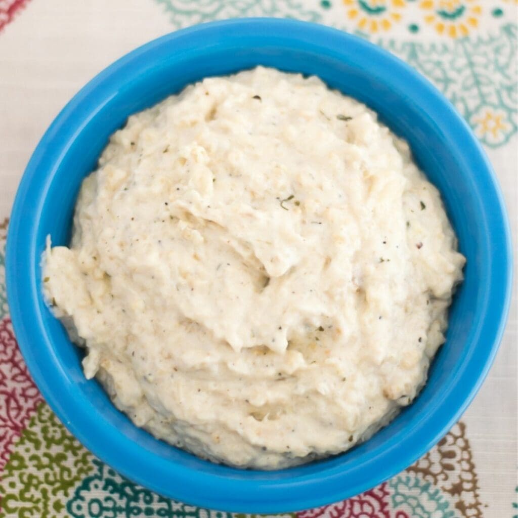 Buttermilk ranch mashed cauliflower in a blue serving bowl.
