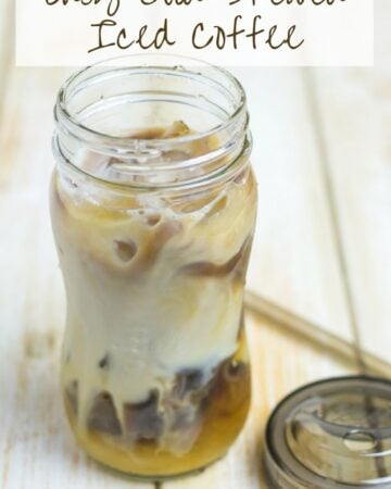 Cold Brewed Iced Coffee in a mason jar with a lid and straw.