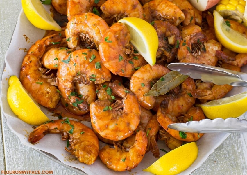 A serving platter piled high with New Orleans Style Barbecue Shrimp