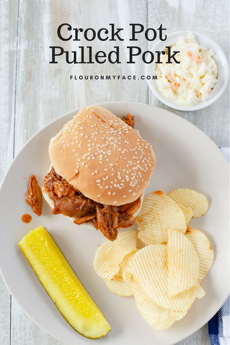 Crock Pot Pulled Pork Sandwich on a plate served with coleslaw.