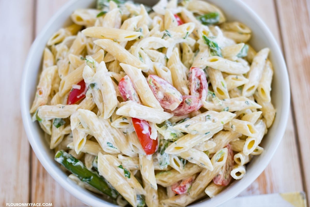 fresh vegetable pasta salad in a serving bowl