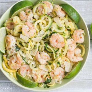 2 Ingredient Shrimp Scampi recipe made with SeaPak Shrimp Scampi and fresh zucchini and yelolow squash zoodles, in a green bowl via flouronmyface.com #ad