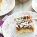 Apricot Struesel Crumb Cake slice on a vintage floral