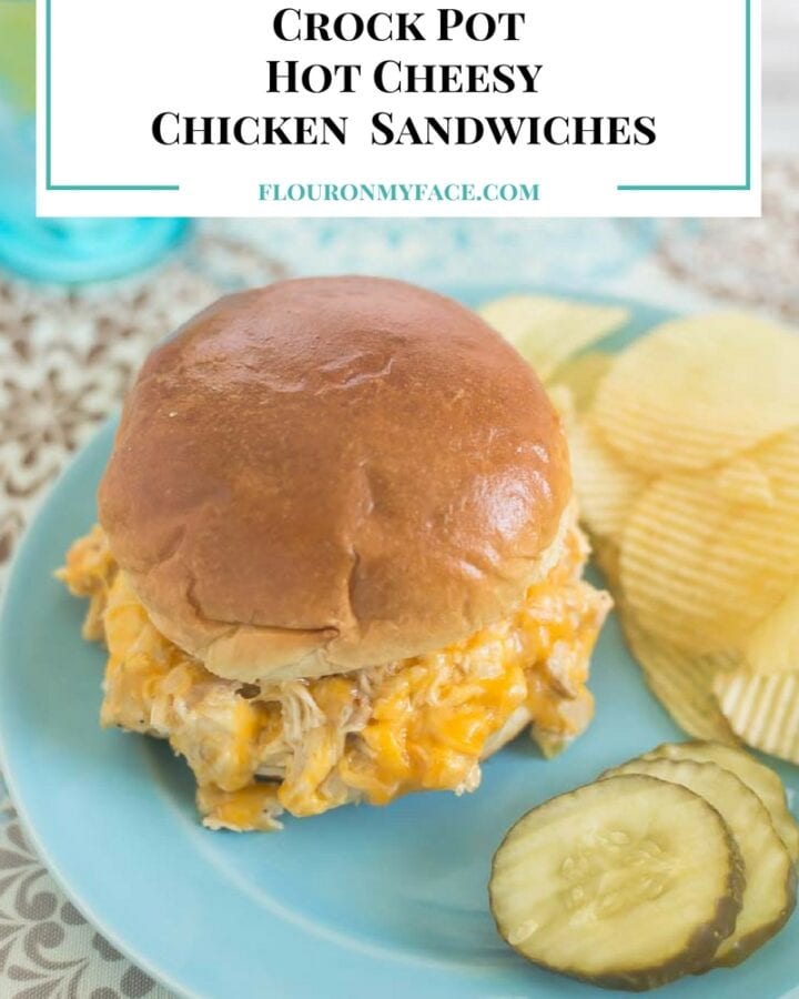 Cheesy chicken sandwich served on a bun with chips.