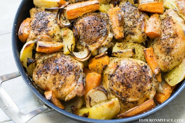 Greek Style Roasted Chicken with potatoes served in a skillet