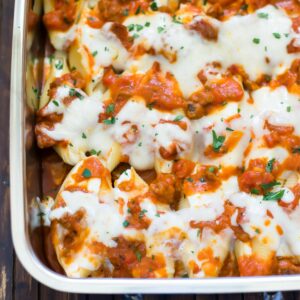 Bakes Butternut Squash and Sausage Stuffed Shells in a lasagna pan.