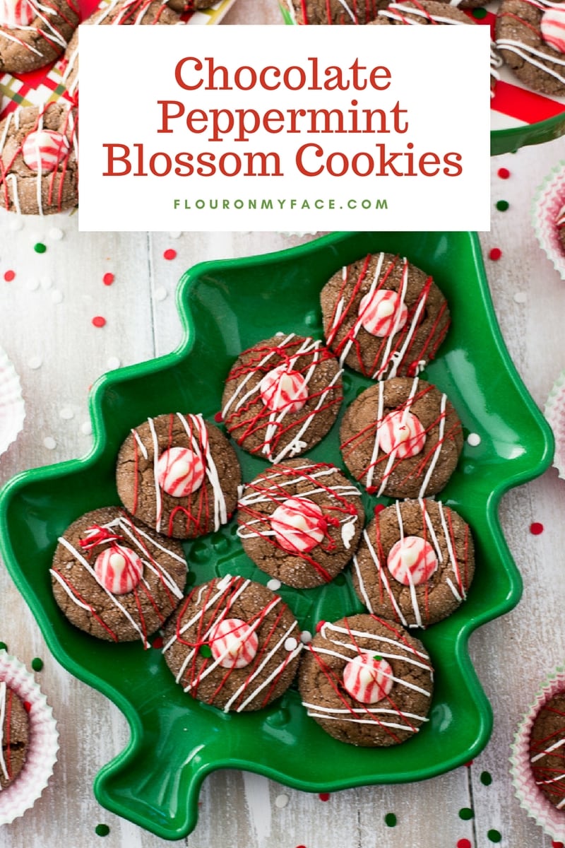 Chocolate Peppermint Blossom Cookies on a Christmas tree shaped cookie platter.