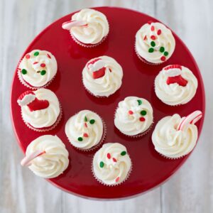 Holiday Sugar Cookie Cupcakes Bites recipe over head photo on a red cake stand
