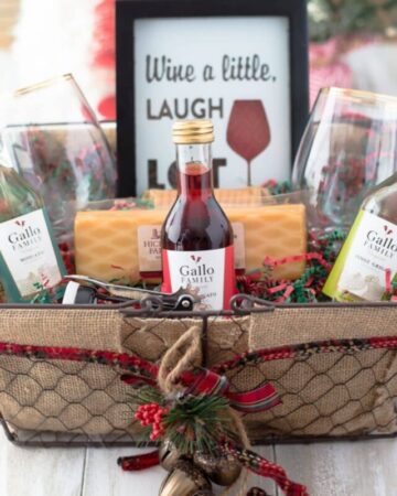 Closeup of a wine gift basket filled with wine themed gifts.