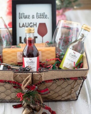 Closeup of a wine gift basket filled with wine themed gifts.