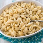 easy Instant Pot Mac and Cheese made with real Smoked Gouda Cheese served in a pale tan oval serving bowl.