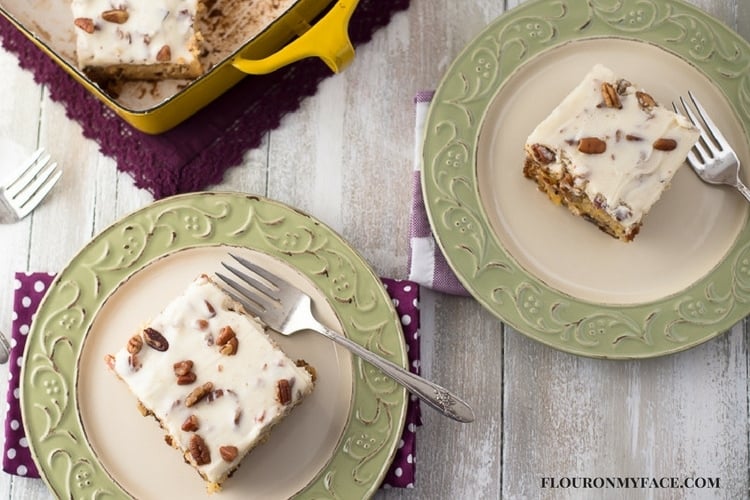 Swedish Nut Cake served in a yellow Dansk 9 xx 13 baking pan and 2 serving plates with vintage silverware.
