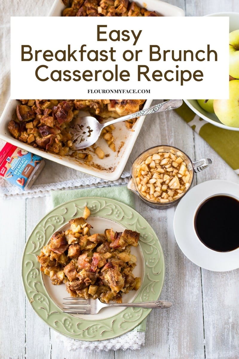 Apple Cinnamon Bacon Casserole recipe served on a green plate, with a casserole dish, syrup, coffee and a bowl of apples.