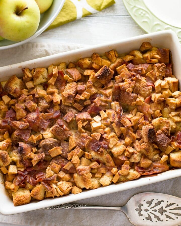 Apple Cinnamon Bacon Breakfast Casserole in a 9x13 baking pan on the table.