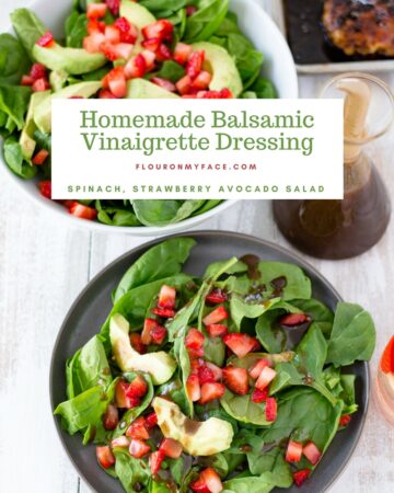 Homemade Balsamic Vinaigrette Dressing in a bottle next to a serving bowl recipe served on a Spinach, Strawberry and Avocado Salad