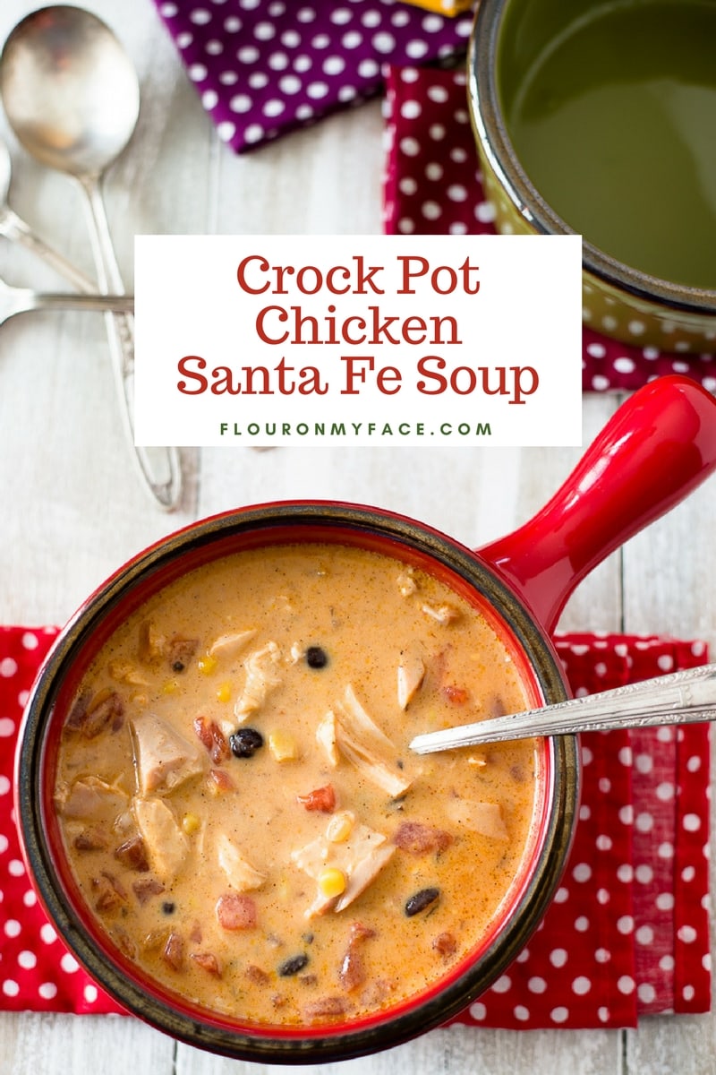 Crock Pot Chicken Santa Fe Soup recipe served in a red soup crock on a red polka dot napkin
