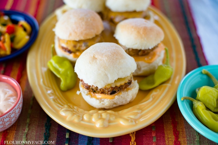 A yellow platter with 5 Airfryer Southwestern Chicken Sliders on table