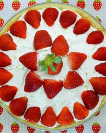 Overhead image of uncut no bake strawberry cheesecake pie.