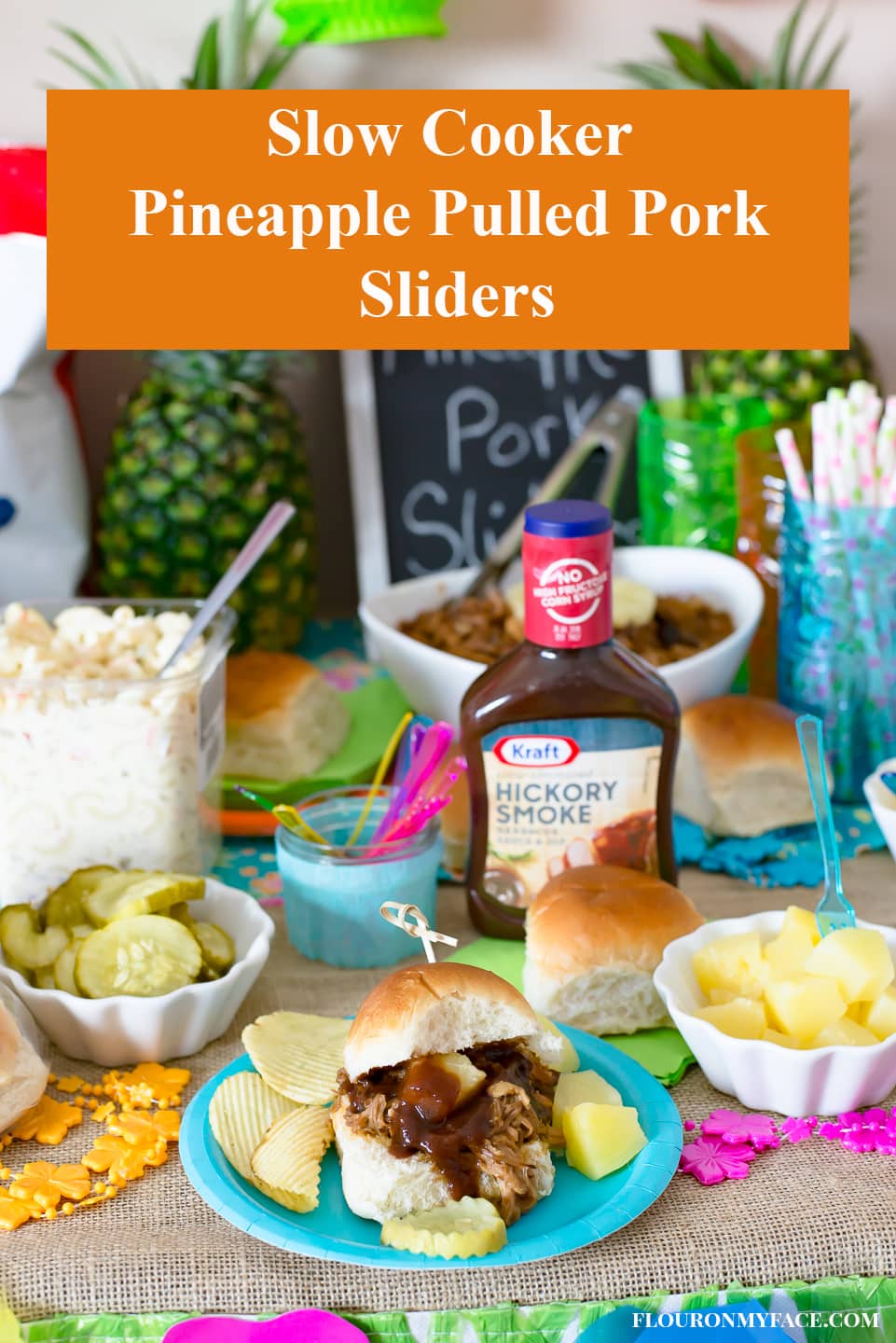 Slow cooker Pineapple Pulled Pork Sliders serve at a Luau themed family game night on the party food table.