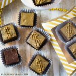 Old Fashioned Million Dollar Fudge recipe decorated with edible gold glitter dust and packaged in a gold and white candy box