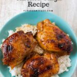 A bowl of Crock Pot Honey Garlic Chicken Thighs served over a bed of cooked white rice.