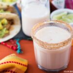 Homemade Horchata recipe served in a glass with a Mexican Food feast.