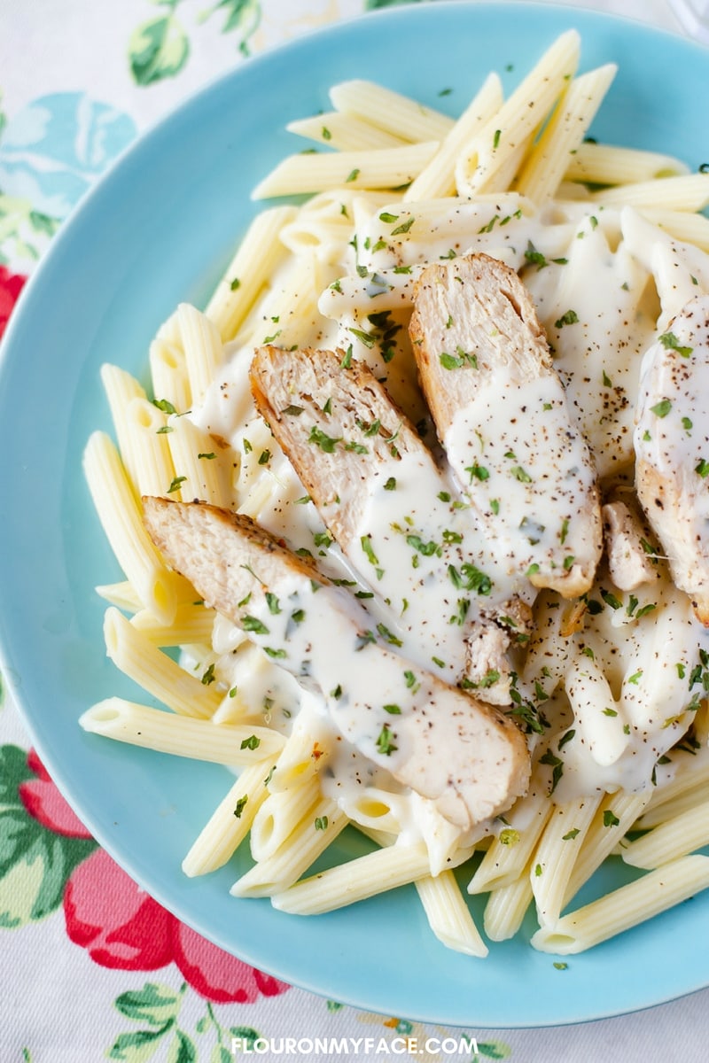 Homemade Basil Alfredo Sauce with grilled Chicken and penne pasta 