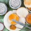 Sweet and spicy Peach and Rosemary jam spread on a biscuit.