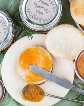 Sweet and spicy Peach and Rosemary jam spread on a biscuit.