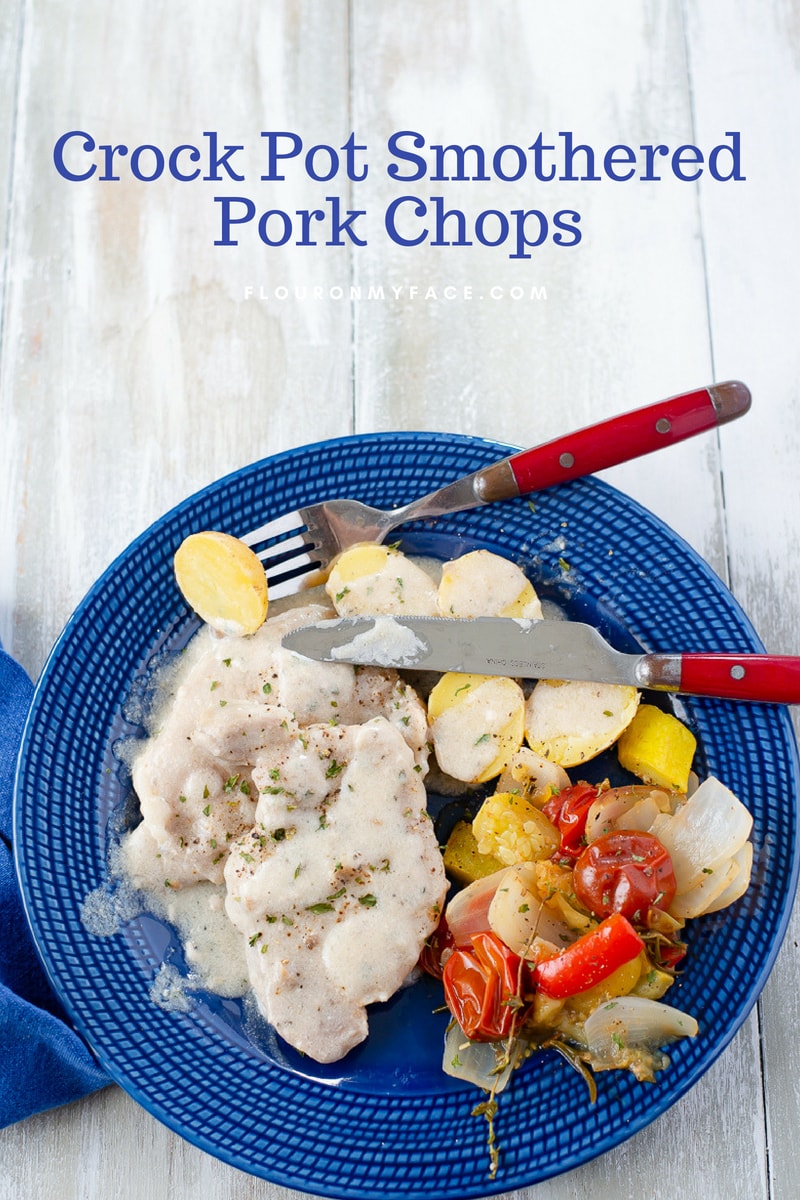 Crock Pot Smothered Pork Chops served with golden baby potatoes and a simple Sauteed Summer Vegetables side dish.
