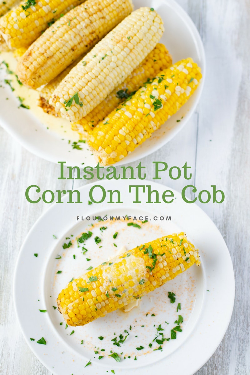 Instant Pot Corn On The Cob served on a white platter.