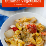 A white serving bowl with simple sauteed summer vegetables recipe.
