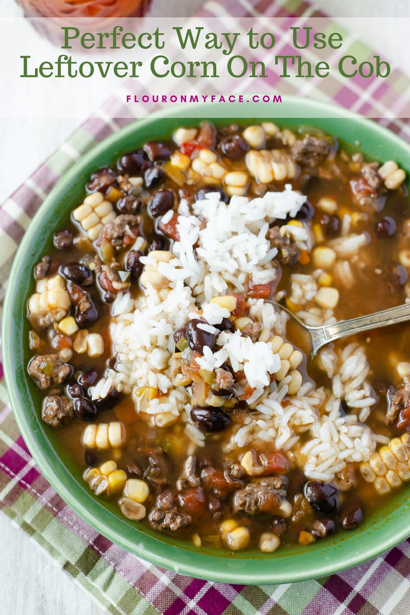 Pork Black Bean Corn Soup recipe served in a green bowl is a great recipe for leftover corn.