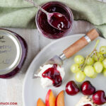 Homemade canned Sweet Cherry Jam recipe served on a Cheese Platter with Goat Cheese, fresh summer fruit and crackers