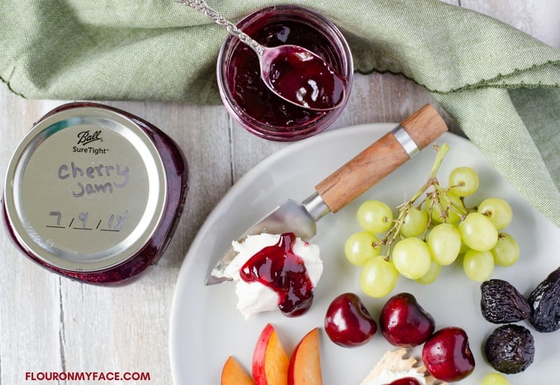 Homemade canned Sweet Cherry Jam recipe served on a Cheese Platter with Goat Cheese, fresh summer fruit and crackers