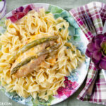 Easy Crock Pot Chicken Asparagus recipe makes moist and delicious boneless chicken breasts with a cheesy and creamy gravy to spoon over cooked noodles or rice.