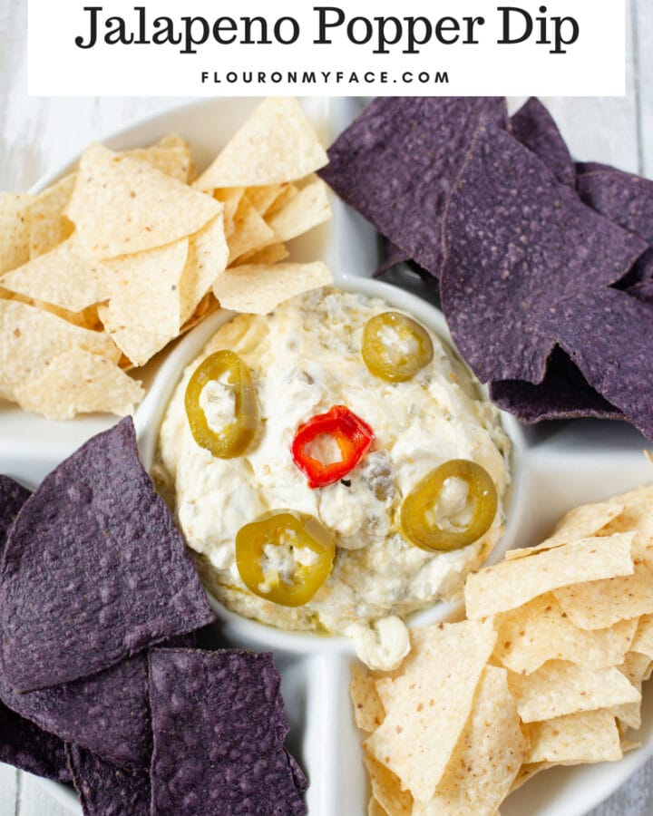 Crock Pot Jalapeno Popper Dip recipe served with white and purple tortilla chips