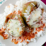 Easy and simple crock pot Stuffed Bell Peppers recipe served over a bed of white rice. Tips on cooking perfect white rice every time.