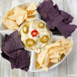 Slow Cooker Jalapeno Popper Dip recipe served with tortilla chips.