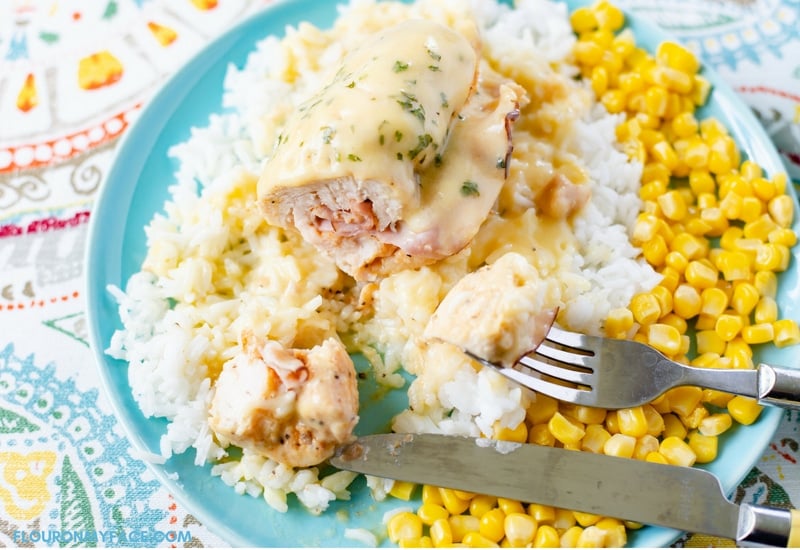 Unbreaded Crock Pot Chicken Cordon Bleu recipe served with white rice and corn.