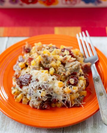 Serving of Butternut Squash casserole on a dinner plate.