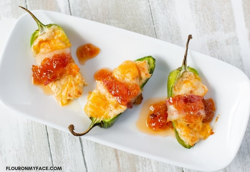 Shrimp Stuffed Bacon Wrapped Jalapeno Peppers appetizer recipe that is so good you can't atop eating them.